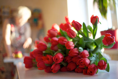 Close-up of red flowers on table