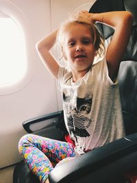 Girl sitting on seat in bus