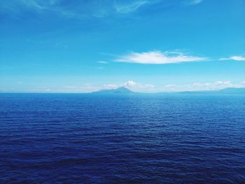 Scenic view of sea against blue sky