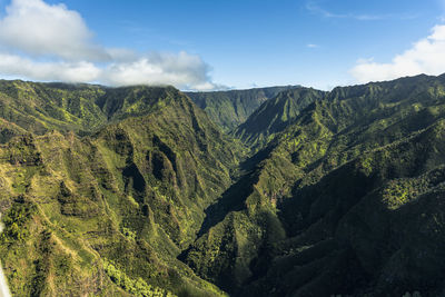 Scenic view of tree mountains against sky