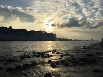 View of calm sea against cloudy sky