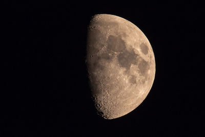 Low angle view of moon against sky at night