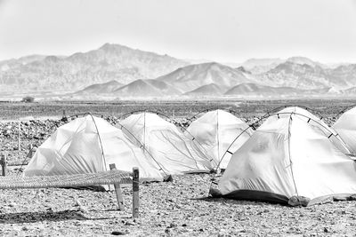 Tent on beach against sky