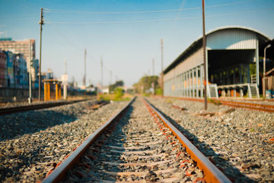 Railroad track against clear sky