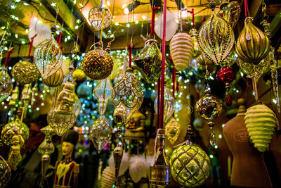 Close-up of decorations hanging at market stall