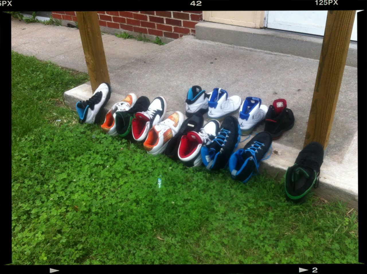 transfer print, grass, auto post production filter, still life, multi colored, high angle view, variation, in a row, day, arrangement, field, sunlight, outdoors, large group of objects, no people, wood - material, close-up, side by side, metal, childhood