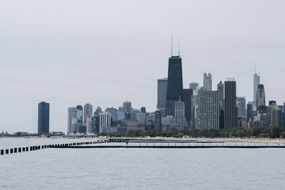 View of buildings in city against sky