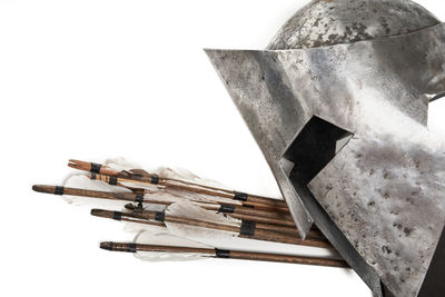 Low angle view of metallic structure against white background