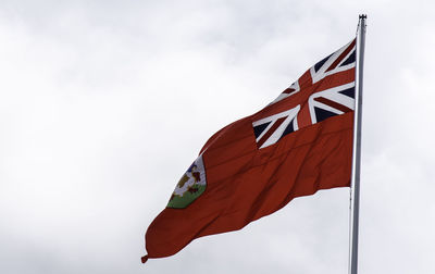 Low angle view of flag against sky