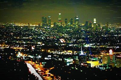 Illuminated cityscape at night