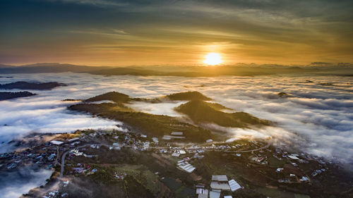 High angle view of city during sunset