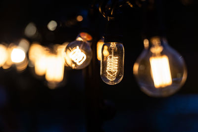 Close-up of illuminated light bulb