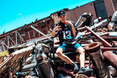 Full length of young man riding motorcycle