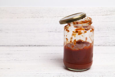 Close-up of glass of jar on table