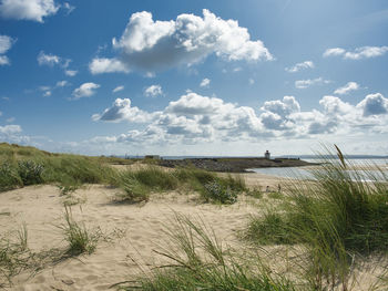 Scenic view of beach against sky