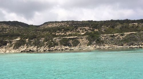 Scenic view of sea against cloudy sky