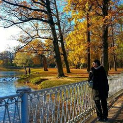 Man standing on tree trunk