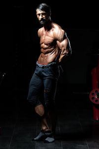 Side view of man exercising in gym