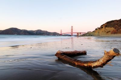 Scenic view of bay against clear sky