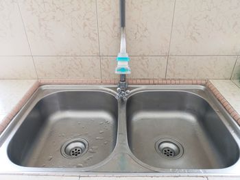 High angle view of faucet in bathroom at home