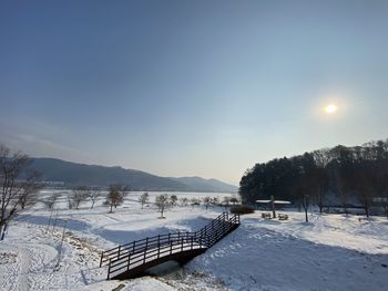 Scenic view of snow covered mountains against sky