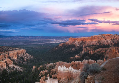 Scenic view of mountains against sky at sunset