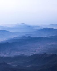 Scenic view of mountains in foggy weather