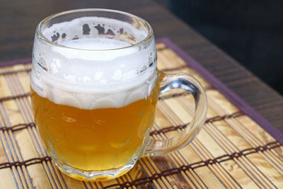 Close-up of beer glass on table