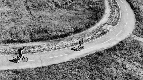 Man riding bicycle on road