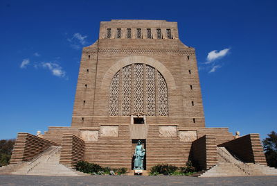 Low angle view of building against blue sky