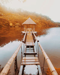 Pier over lake against sky