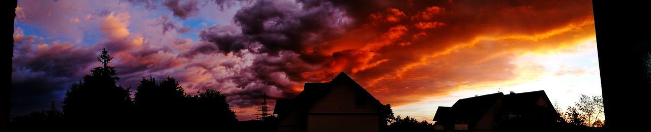 Low angle view of silhouette buildings against sky during sunset