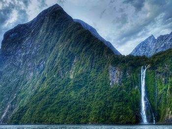 A waterfall in milford sound, new zealand