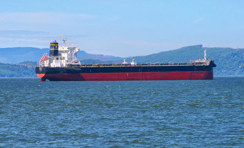 View of ship in sea against sky