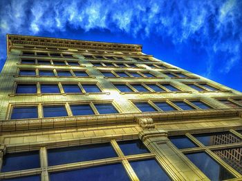 Low angle view of building against blue sky