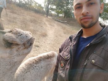 Portrait of young man standing outdoors