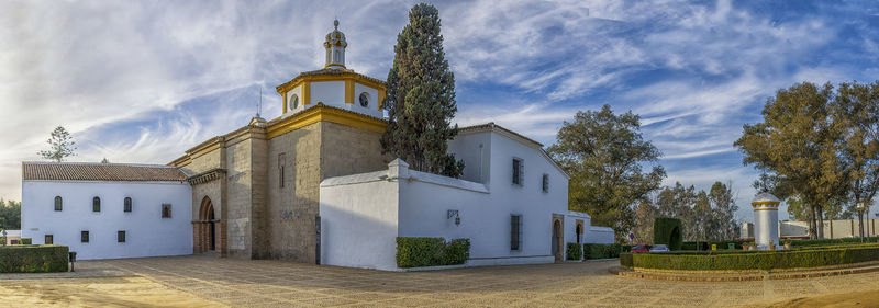 Low angle view of bell tower against sky