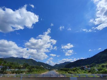 Scenic view of mountains against blue sky