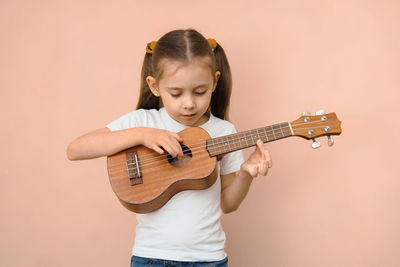 Young woman playing guitar