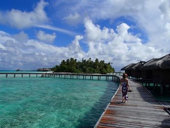 People walking on jetty