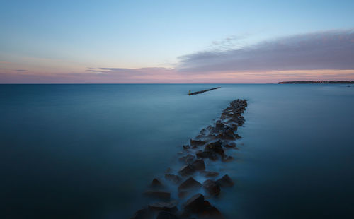 Scenic view of sea at sunset