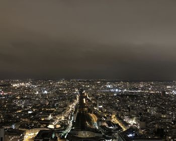 High angle view of illuminated city buildings at night