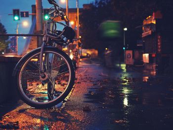 Rainy evening in the city. bicycle on wet street