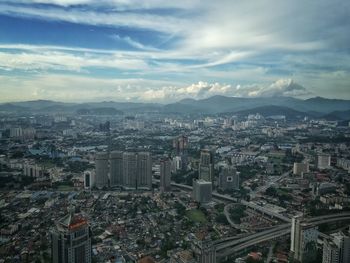 Aerial view of cityscape against sky