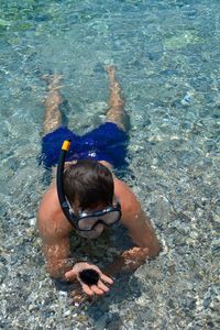 High angle view of man swimming in sea