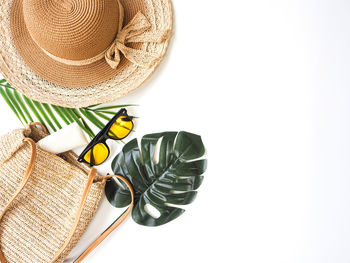 High angle view of hat on table against white background