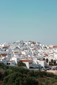 High angle shot of townscape against clear sky