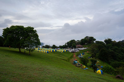 People on field against sky