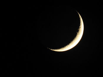 Low angle view of moon against sky at night