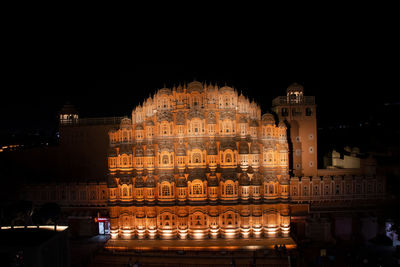 Illuminated buildings in city at night